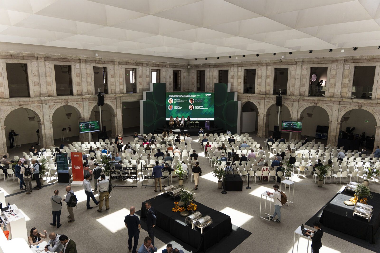 Overhead view of the plenary session and seated audience inside the historic courtyard of Convento do Beato