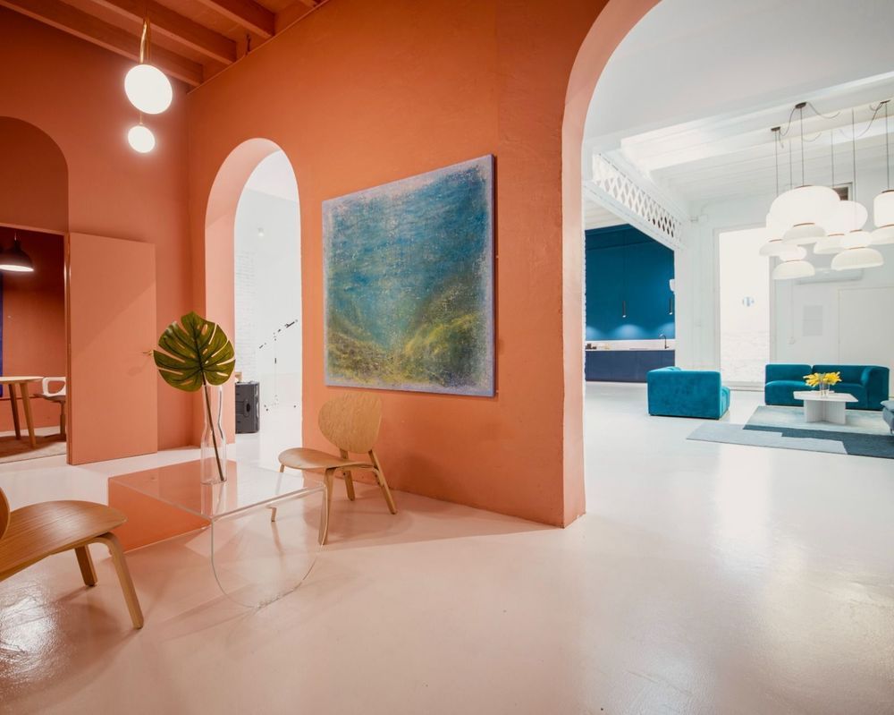 Vibrant Industrial Space With Coral Walls