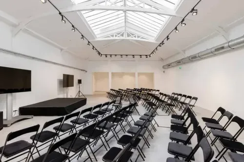 Expansive White Loft with skylit ceilings