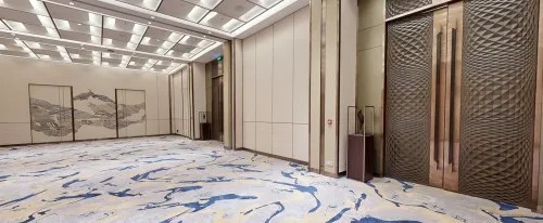 Elegant Blue-Accented Cream Event Hall for Seminars and Forums