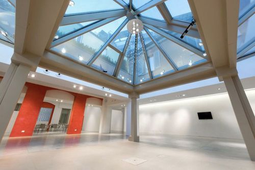 All-White Skylit Venue With Minimalist Design for Iconic Events