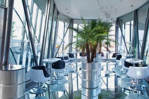 Futuristic Glass Bar With Stunning City Views for Exclusive Mixers