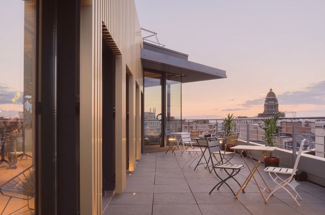 Modern rooftop event venue in Brussels with city views, an outdoor terrace and space for corporate receptions and networking events.