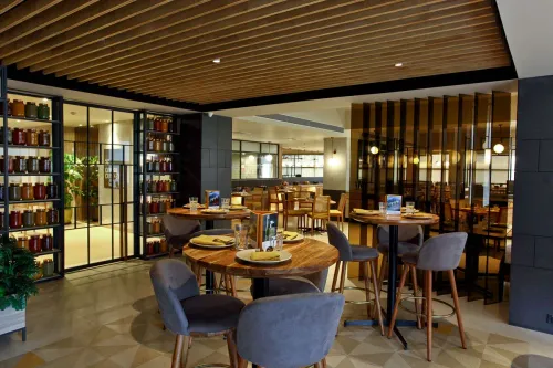 Sleek Grey-Toned Restaurant With Private Room for Business Dinners