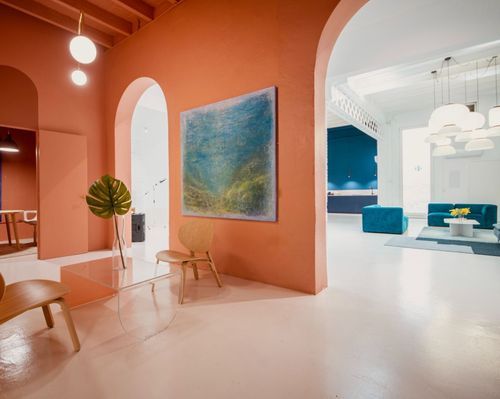 Vibrant Industrial Space With Coral Walls