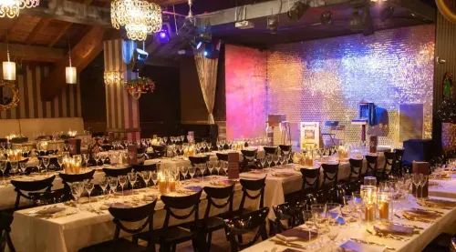 Glamorous Rustic Venue With Shimmering Wall Backdrops