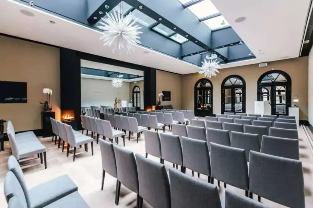 Skylit Hall With Starburst Chandeliers