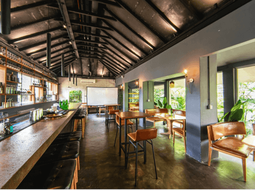 Jungle-inspired event venue in Singapore with rustic interiors, a contemporary bar and flexible space for receptions and networking events.