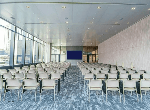 Modern Conference Room With Floor-to-Ceiling Windows and City View for Networking and Presentations